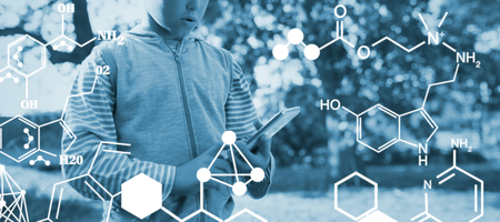 Digitally generated image of chemical structure against little boy using mobile phone in forestの写真素材