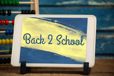 Vector image of pink paint strokes against digital tablet by abacusの写真素材