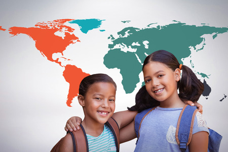 Portrait of smiling friends against grey backgroundの写真素材