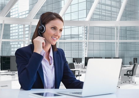 Digital composite of Happy customer care representative woman against office background