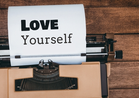 Digital composite of Love Yourself  text written on page with typewriterの写真素材