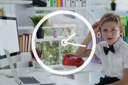 Digital composite of Clock icon against office kid boy holding a pen background