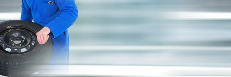 Digital composite of Mechanic repairing a wheelの写真素材