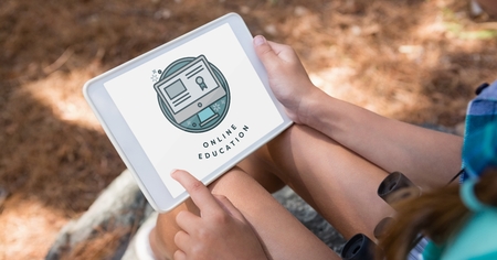 Digital composite of Person using a tablet with e-learning information in the screenの写真素材