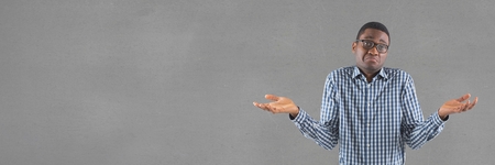 Digital composite of Confused man standing against wide blank greyの写真素材