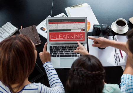 Digital composite of People pointing to a computer with e-learning information in the screenの写真素材