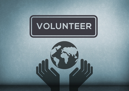 Digital composite of volunteer text with world in hands care icon in blue roomの写真素材