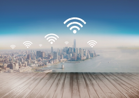 Digital composite of City with icons of wifi