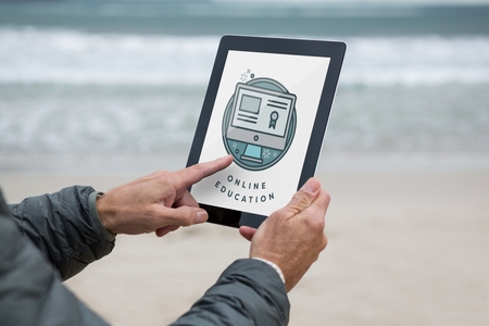 Digital composite of Man using a tablet with e-learning information in the screenの写真素材
