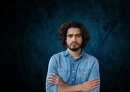 Digital composite of Man standing with blue backgroundの写真素材