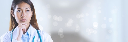 Digital composite of Doctor woman thinking against white backgroundの写真素材