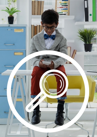 Digital composite of Magnifying glasses icon against office kid boy using a phone backgroundの写真素材