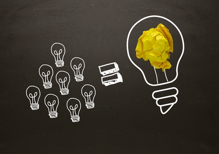 Digital composite of Lots of little light bulbs equal big light bulb with crumpled paper and blackboardの写真素材