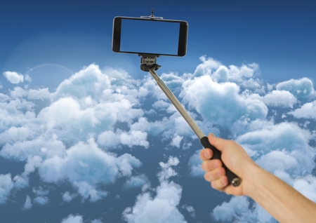 Digital composite of Selfie stick in the sky diving cloudsの写真素材