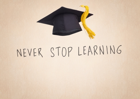 Digital composite of Never Stop Learning text with graduate hatの写真素材