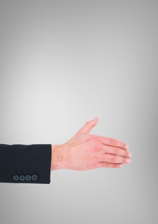 Digital composite of Hand reaching for handshakeの写真素材