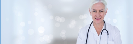 Digital composite of Doctor woman standing against white backgroundの写真素材