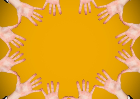 Digital composite of Hands in circle with yellow backgroundの写真素材