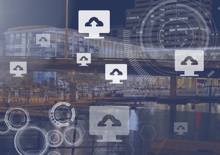 Digital composite of Upload computer icons over city