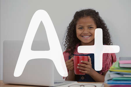 Digital composite of A+ text against happy office kid girl holding a cup of coffeeの写真素材