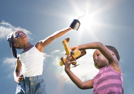 Digital composite of Kids playing under sky sunshineの写真素材