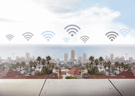 Digital composite of Wifi icons over city