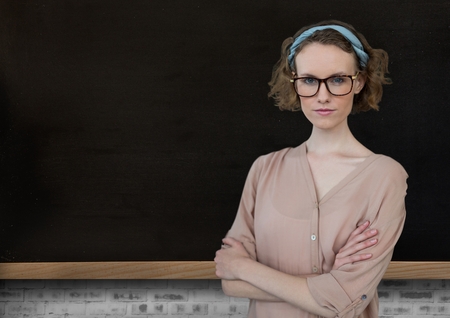 Digital composite of Woman standing with blackboardの写真素材