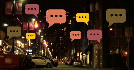 Digital composite of Chat bubbles over night cityの写真素材