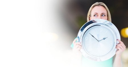 Digital composite of Woman holding clock in front of room