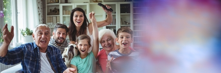 Digital composite of Family laughing on couch with blurry purple transition