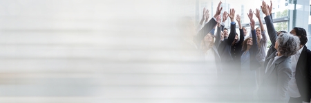 Digital composite of Business people celbrating and raising hands with transitionの写真素材