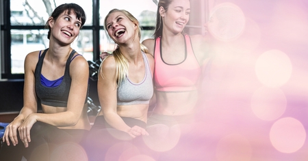 Digital composite of Athletes relaxing in gymの写真素材