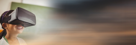 Digital composite of Girl in virtual reality headset against green chalkboard and blurry sunset transitionの写真素材