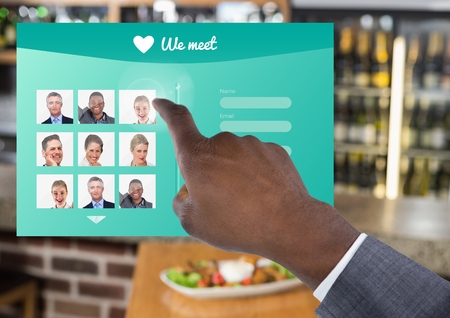 Digital composite of Hand touching Social Media App Interface in Barの写真素材