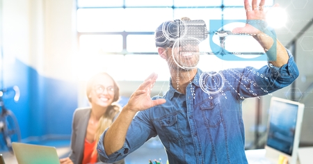 Digital composite of Businessman using VR in office