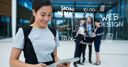 Digital composite of Businesswoman using digital tablet by icons outside officeの写真素材