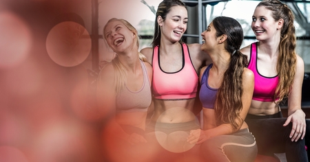 Digital composite of Fit young women smiling in gymの写真素材