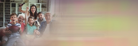 Digital composite of Family laughing on couch with motion blur transition
