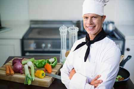 Digital composite of chef  standing in kitchen