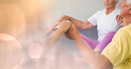 Digital composite of Senior people holding hands in gymの写真素材