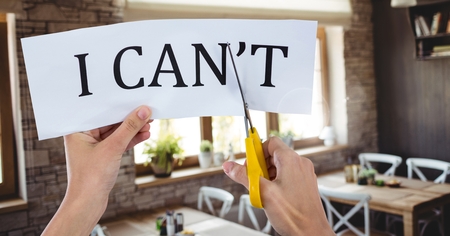 Digital composite of Hands cutting I Can't text on paperの写真素材