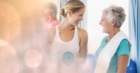 Digital composite of Portrait of beautiful people smiling and looking at each other in houseの写真素材