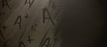 Graphic image of A plus grade against blackboardの写真素材
