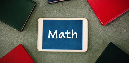 Math text on white background against oberhead view of digital tablet surrounded with colorful organizersの写真素材