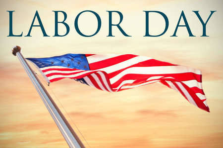 Labor day text  against cloudy sky landscape