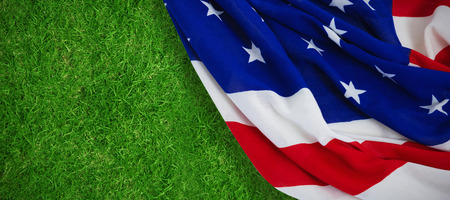 Close-up of American flag against closed up view of grassの写真素材