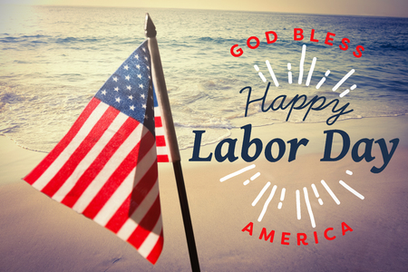 Digital composite image of happy labor day and god bless America text against beautiful beach on a sunny dayの写真素材