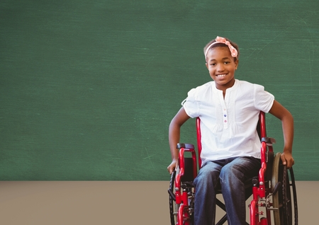 Digital composite of Disabled girl in wheelchair in front of blackboard