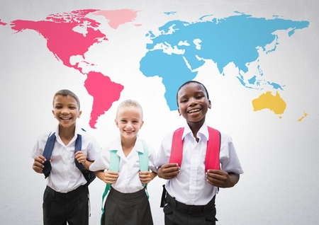 Digital composite of School kids in front of colorful world mapの写真素材