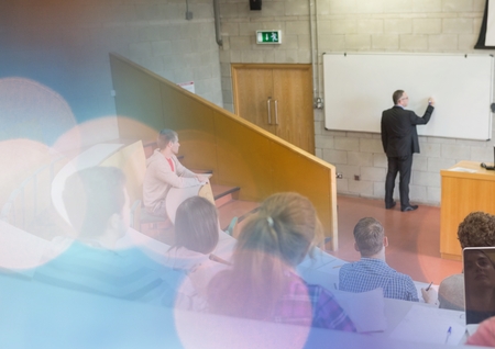 Digital composite of University teacher with classの写真素材